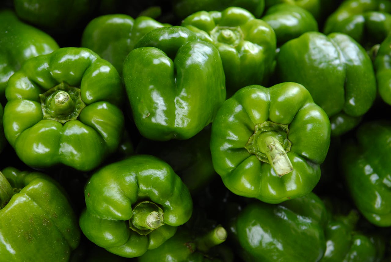 The Art of Drawing Readers In: Your attractive post title goes here Close-up of fresh organic green bell peppers showcasing vibrant color and freshness.